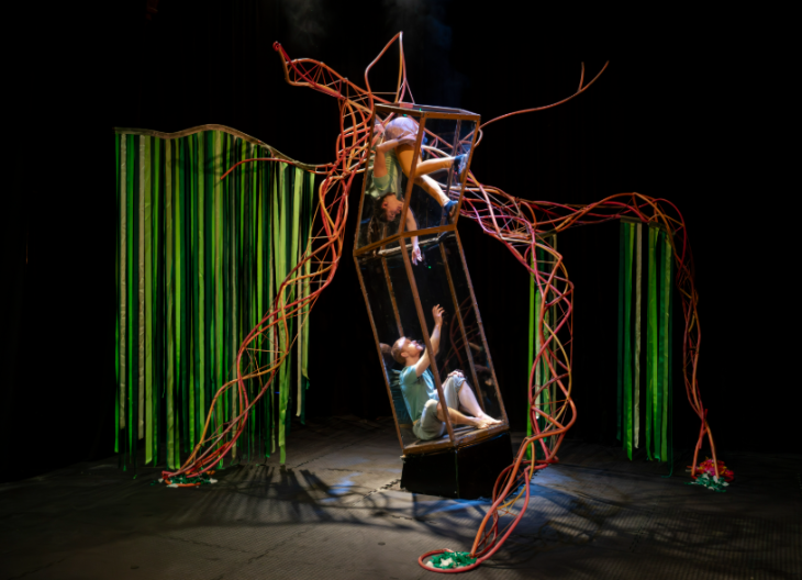 Things to do in London this weekend: two performers on a climbing frame-style structure on a dimly-lit stage