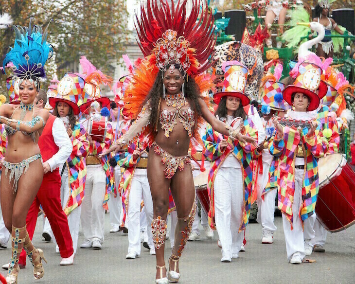Lord Mayor's Show 2026: a group of performers, including women in Carnival-style costumes, in the parade.