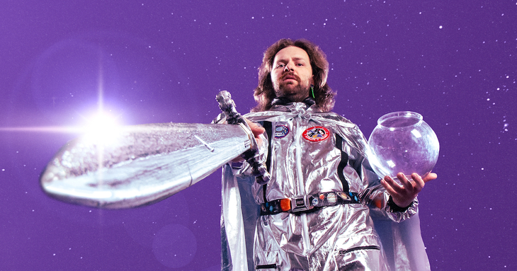 A man in a silver space suit with a sword