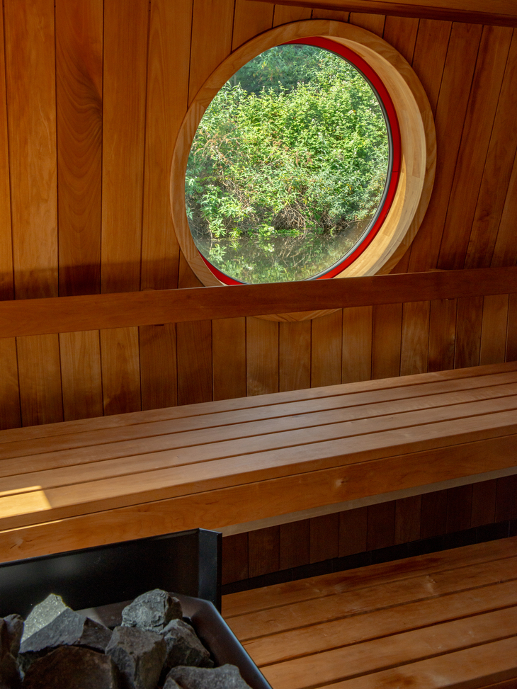 A sauna with a porthole