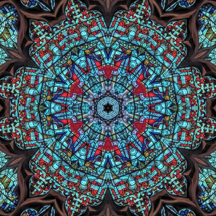 Things to do in London today:  A kaleidoscope pattern created from stained glass imagery, featuring repeating motifs of a crowned figure in blue and red robes, arranged in a circular, symmetrical design.