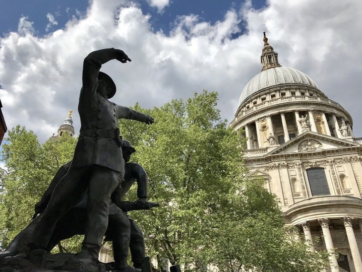 A sculpture of firefighters in front of St Paul's