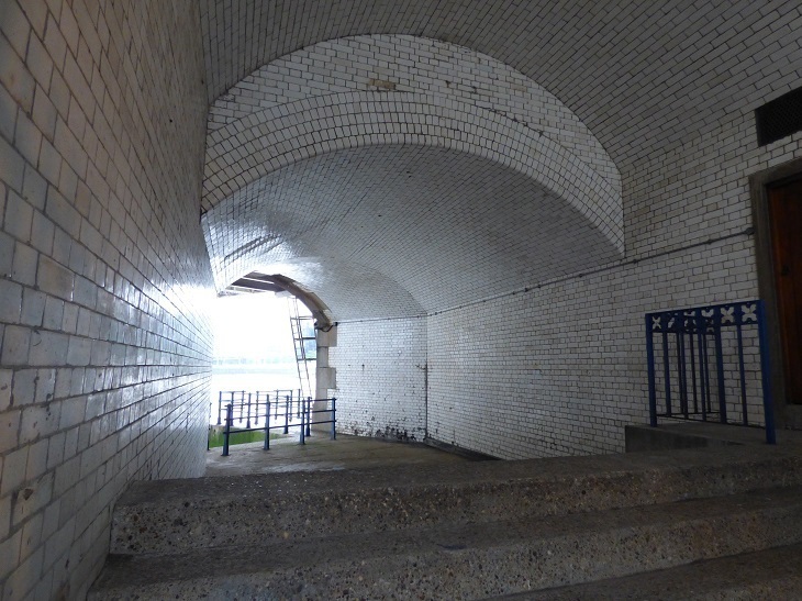 A while tiled space next to the river