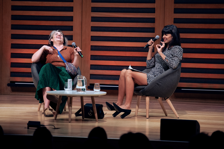 Things to do in London today: two women on stage, each holding a microphone and laughing