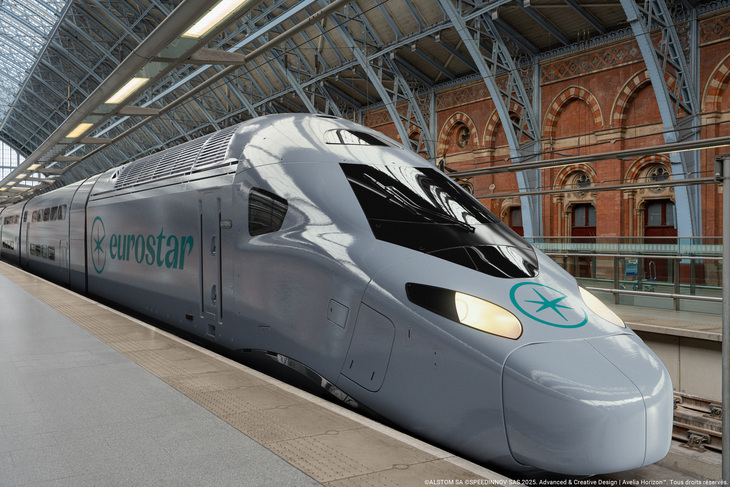 A silver coloured Eurostar double-decker train alongside a platform at St Pancras
