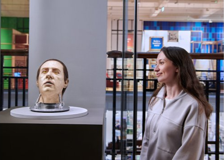 An android head from Star Trek with a visitor looking on