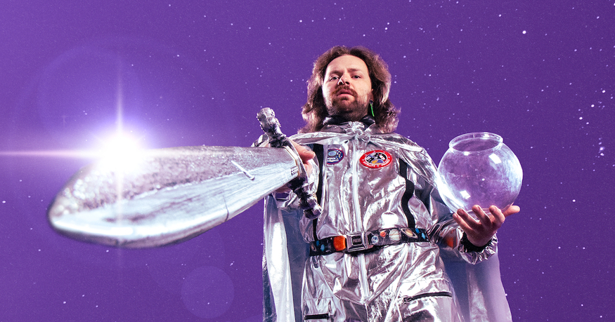 A man in a silver space suit with a sword
