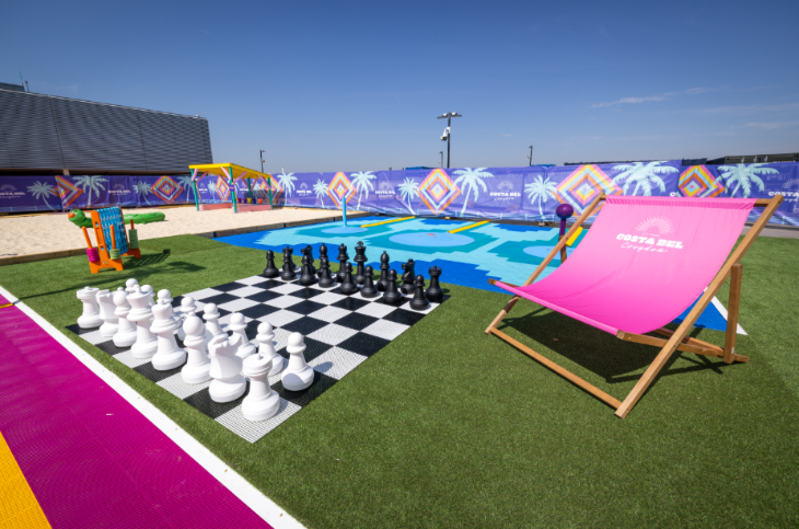 Things to do in London August bank holiday weekend 2026: a giant chess board and a deckchair in front of a sandpit at an open-air pop-up beach