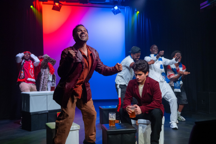 Members of the cast performing on stage