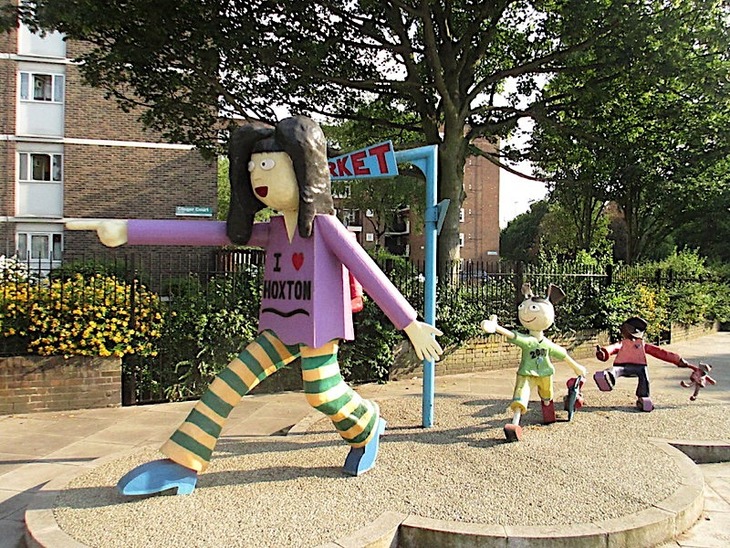 A sculpture of a family walking through Hoxton