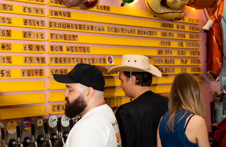 Things to do in London today: bar tenders behind the bar in a brewery