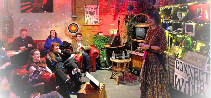 Things to do in London this weekend: a group of people sitting on sofas watching a performer