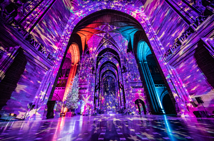 Christmas 2026 best light trails London: the interior of a church illuminated in purple