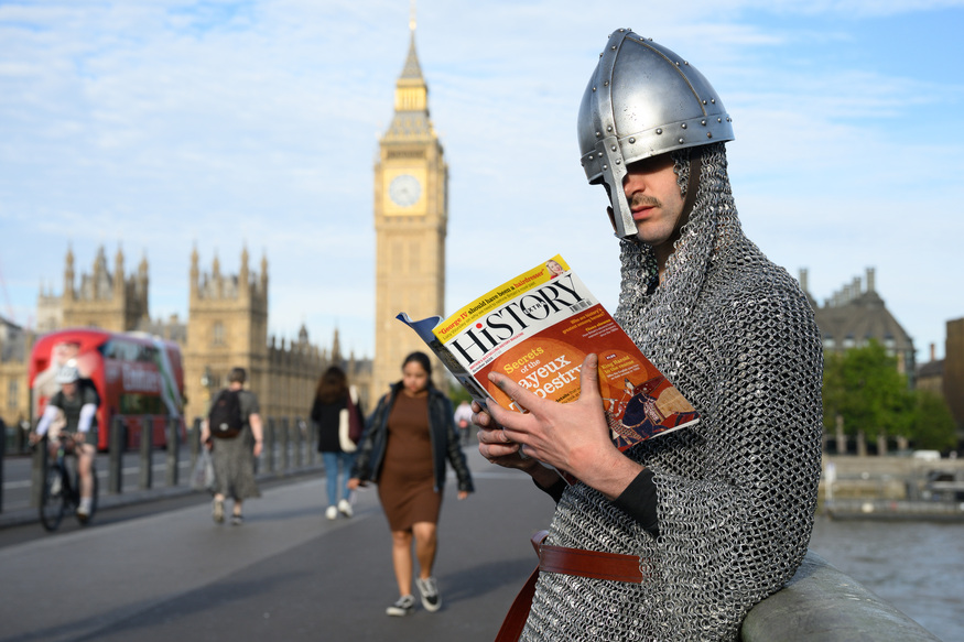 'William the Conqueror' reading s history magazine in front of Big Ben