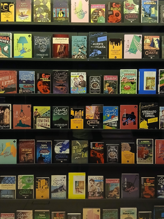 A display of many of Christie's books, in different editions and different languages