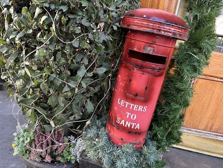 Churchill Arms Kensington Christmas lights: A 'Letters to Santa' post box on a display outside the pub