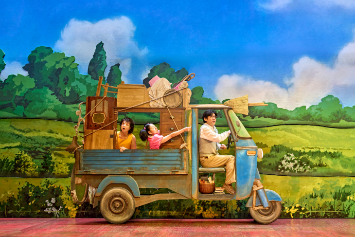 Things to do in London in December 2026: three cast members in a rickshaw type truck on stage in My Neighbour Totoro