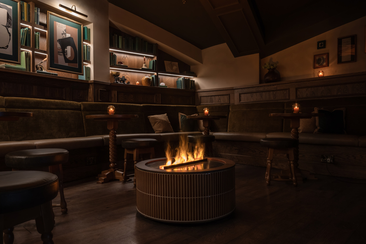A modern pub with an indoor fire pit