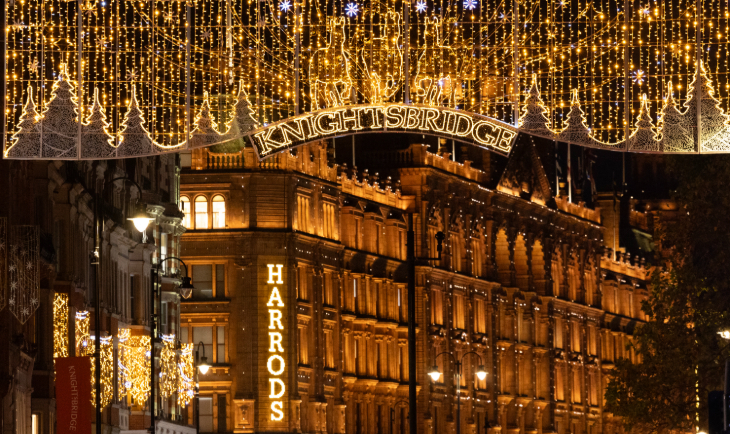 When are London Christmas lights switched on for 2026: glowing golden Christmas lights in front of Harrods