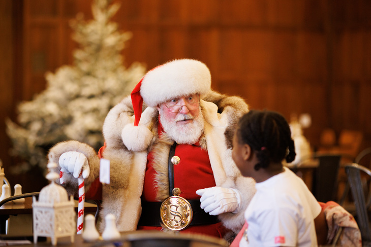 Santa chatting to a child