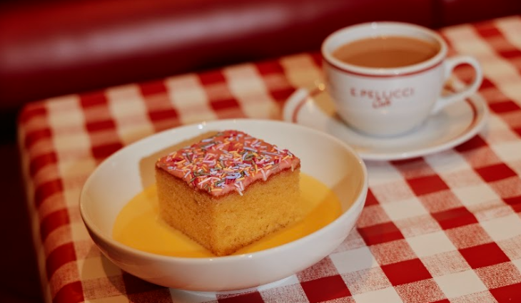 'School cake' with custard and a cup of tea