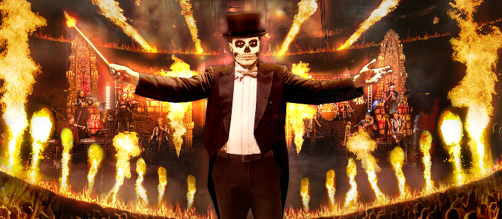 Things to do in London today: a person in a black suit, face painted white like a skull, against a backdrop of pyrotechnics