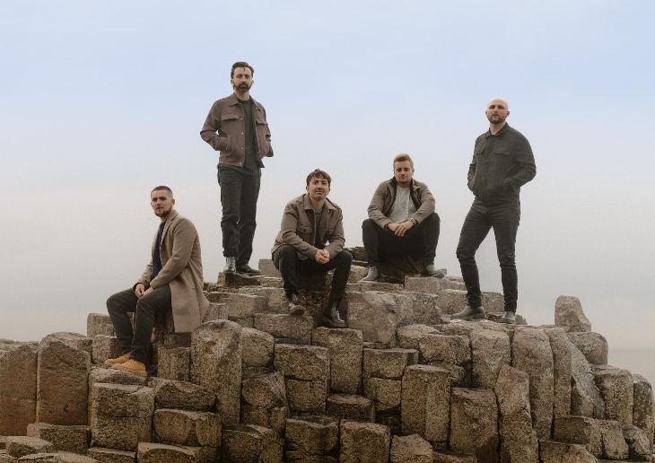 Things to do in London today: the five members of The Shamrocks posing for a photo on Giant's Causeway