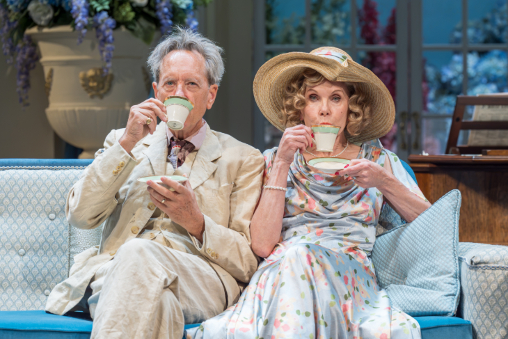 Things to do in London in December 2026: Richard E. Grant and Christine Baranski sitting on a sofa drinking from fancy tea cups