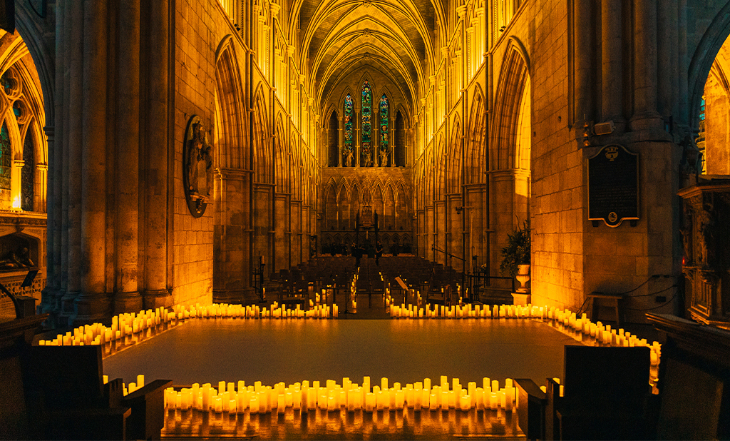 Things to do in London this weekend:  the interior of Southwark Cathedral illuminated with hundreds of candles