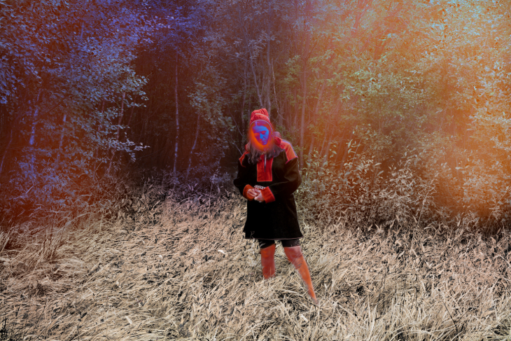 Things to do in London in November 2026:  a filtered photo of a person standing in long grass in a forest