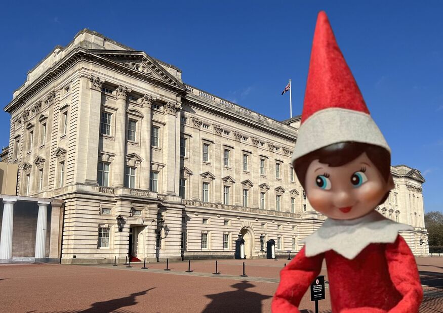 A giant elf in front of Buckingham Palace